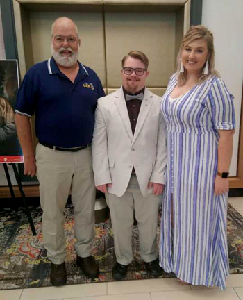 Lucas with his father and sister